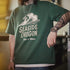 Person wearing a green t-shirt with 'Seaside Oregon Ride a Wave' design.
